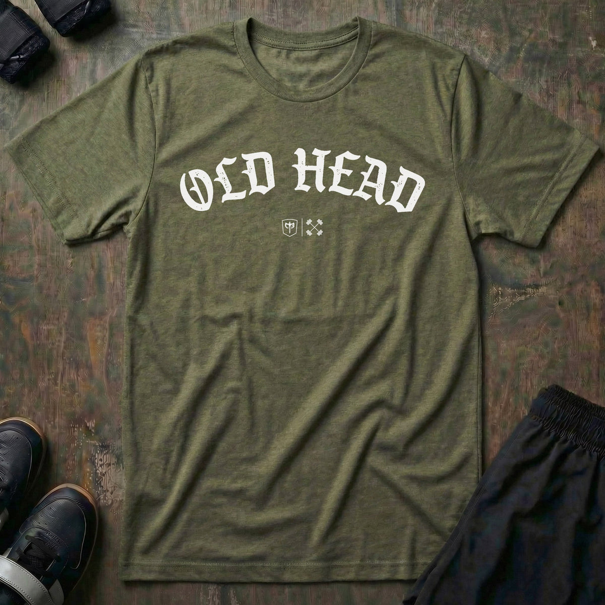 Old Head tee in Military: OLD HEAD in bold old English lettering arched across the chest with small CB marks below