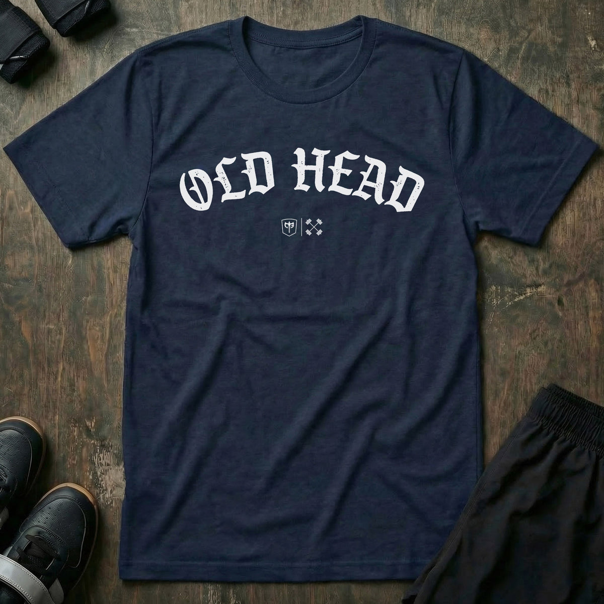 Old Head tee in Navy: OLD HEAD in bold old English lettering arched across the chest with small CB marks below