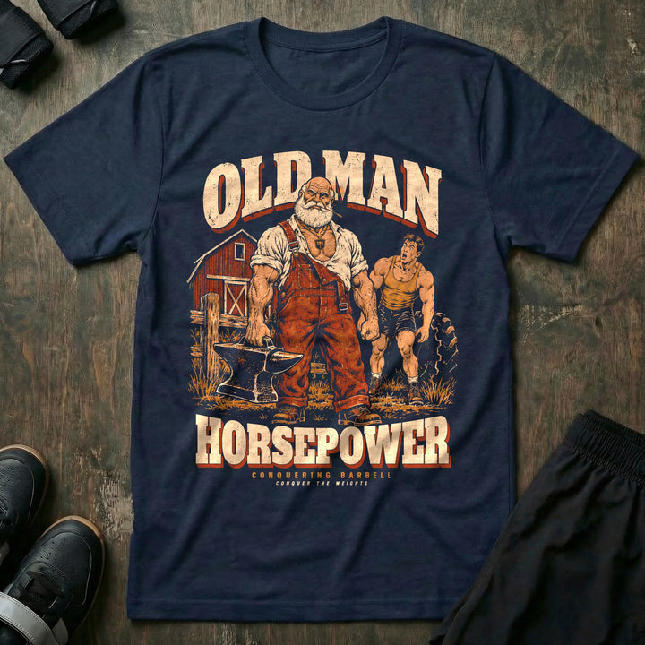 Old Man Horsepower - Tee front graphic in Navy with a white-bearded farmer in overalls carrying an anvil in one hand while a young lifter strains at a tractor tire - Conquering Barbell