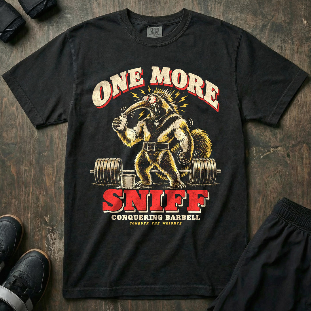 One More Sniff - Relaxed Fit Tee front graphic in Black with a bug-eyed anteater sniffing a bottle of smelling salts in front of a loaded barbell - Conquering Barbell