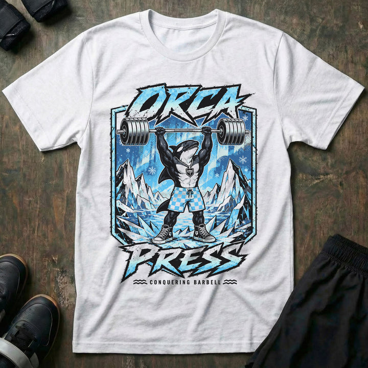Orca Press tee in White: a jacked orca in checkered shorts and high tops pressing heavy iron overhead