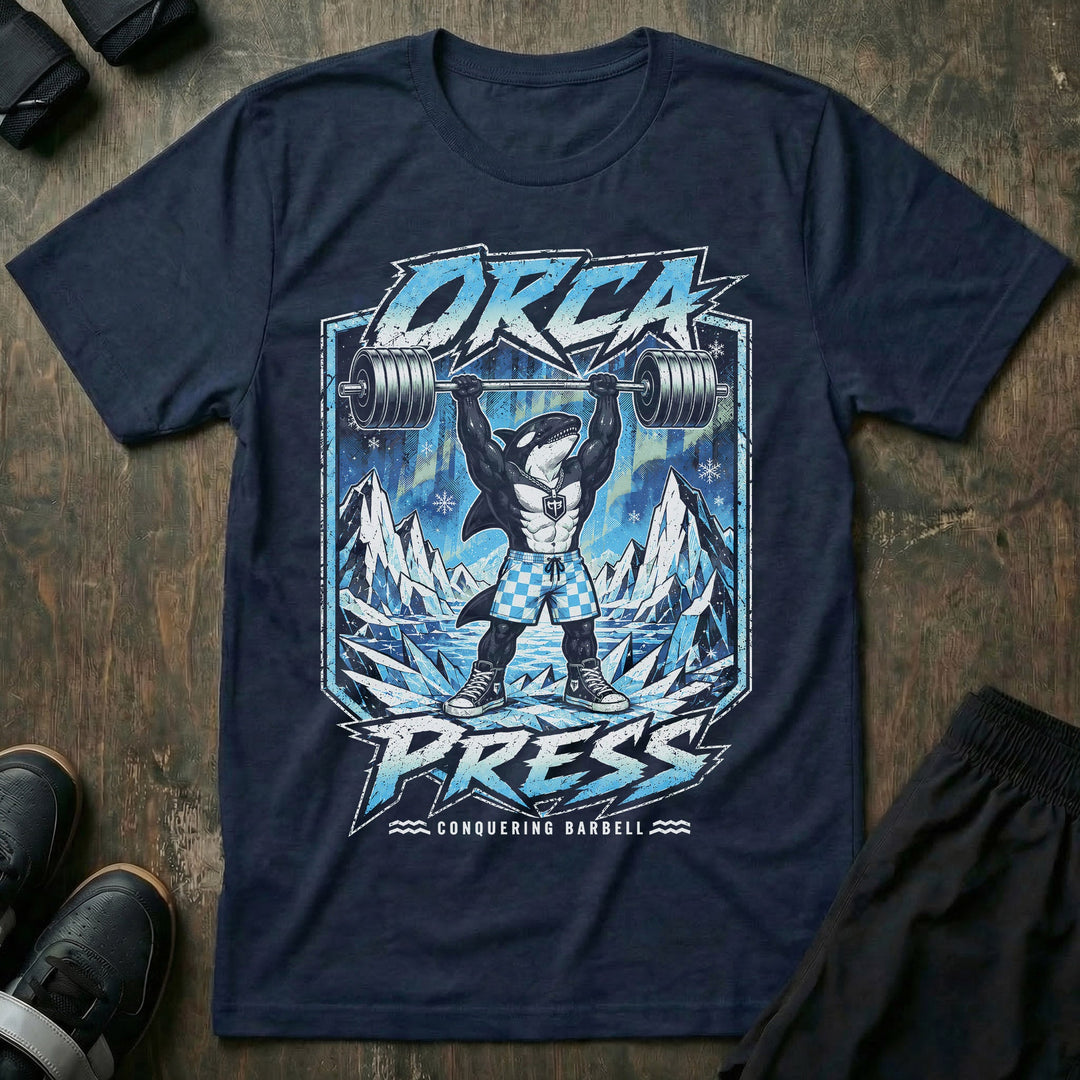Orca Press tee in Navy: a jacked orca in checkered shorts and high tops pressing heavy iron overhead