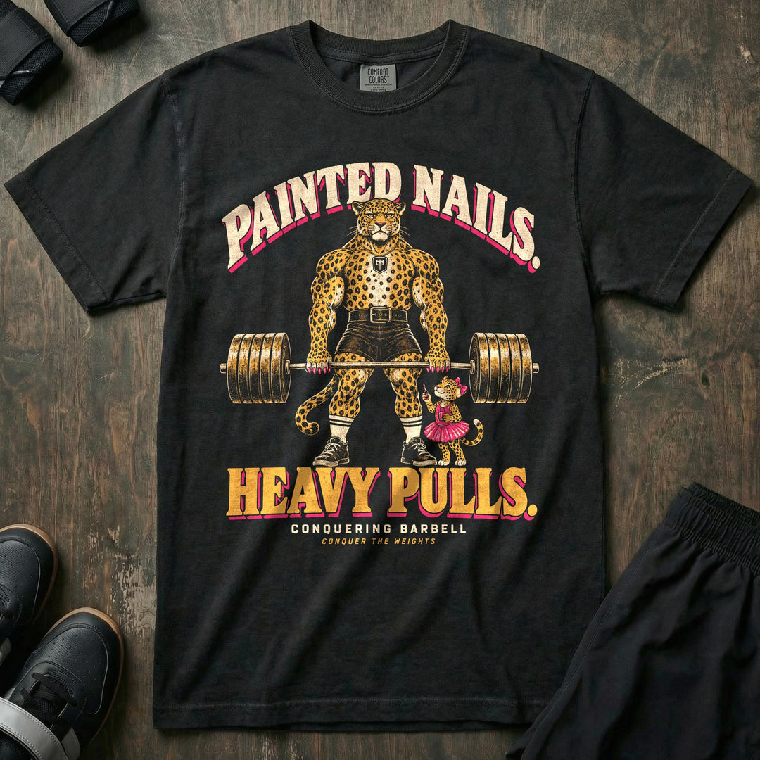 Painted Nails. Heavy Pulls - Relaxed Fit Tee front graphic in Black with a leopard dad with pink painted claws deadlifting a loaded barbell beside his daughter in a pink tutu holding nail polish - Conquering Barbell