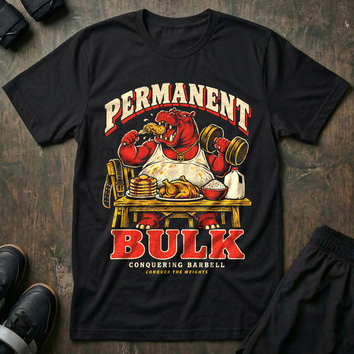 Permanent Bulk - Tee front graphic in Black with a red hippo eating a drumstick and curling a dumbbell at a table of food - Conquering Barbell