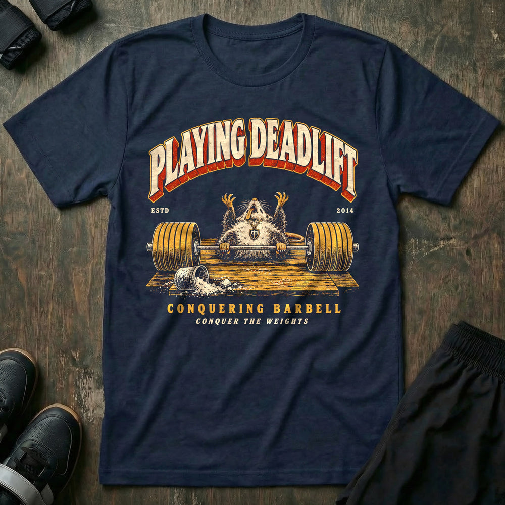Playing Deadlift - Tee front graphic in Navy with an opossum playing dead on the platform behind a loaded barbell - Conquering Barbell