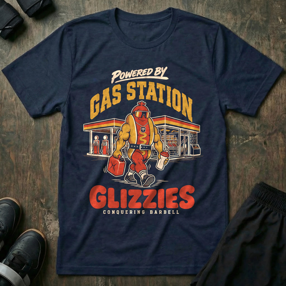 Powered by Gas Station Glizzies - Tee front graphic in Navy with a muscular hot dog lifter walking out of a gas station under POWERED BY GAS STATION GLIZZIES - Conquering Barbell