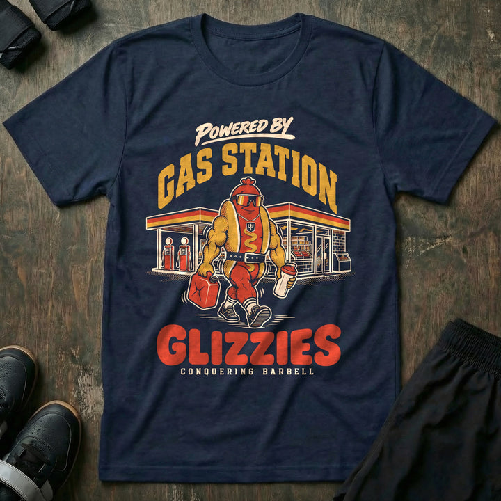 Powered by Gas Station Glizzies - Tee front graphic in Navy with a muscular hot dog lifter walking out of a gas station under POWERED BY GAS STATION GLIZZIES - Conquering Barbell