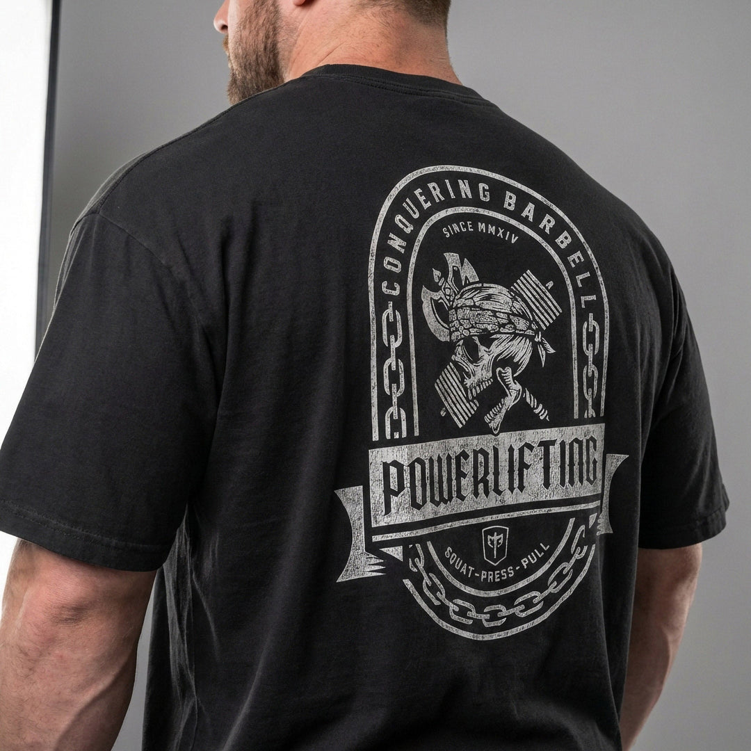 Powerlifting Badge relaxed fit tee in Black: a distressed emblem with chain border