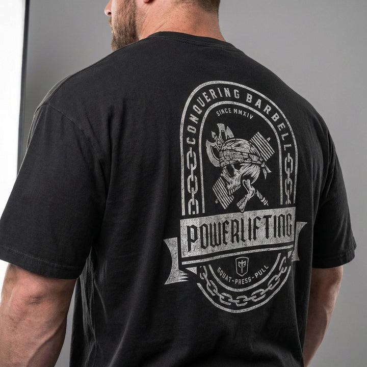 Powerlifting Badge relaxed fit tee in Black: a distressed emblem with chain border