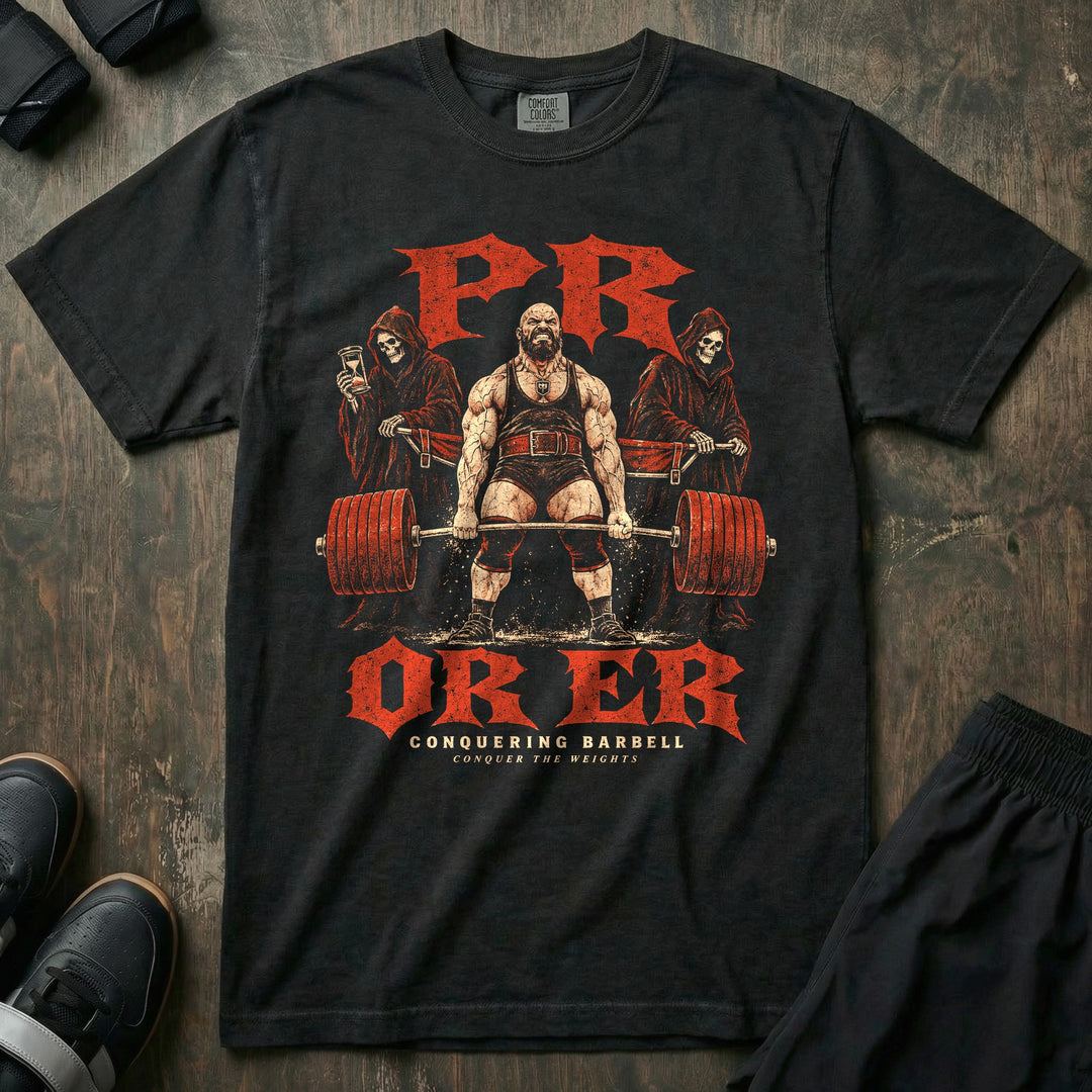 PR or ER - Relaxed Fit Tee front graphic in Black with a bearded lifter grinding a deadlift while two reapers hold a stretcher behind him - Conquering Barbell
