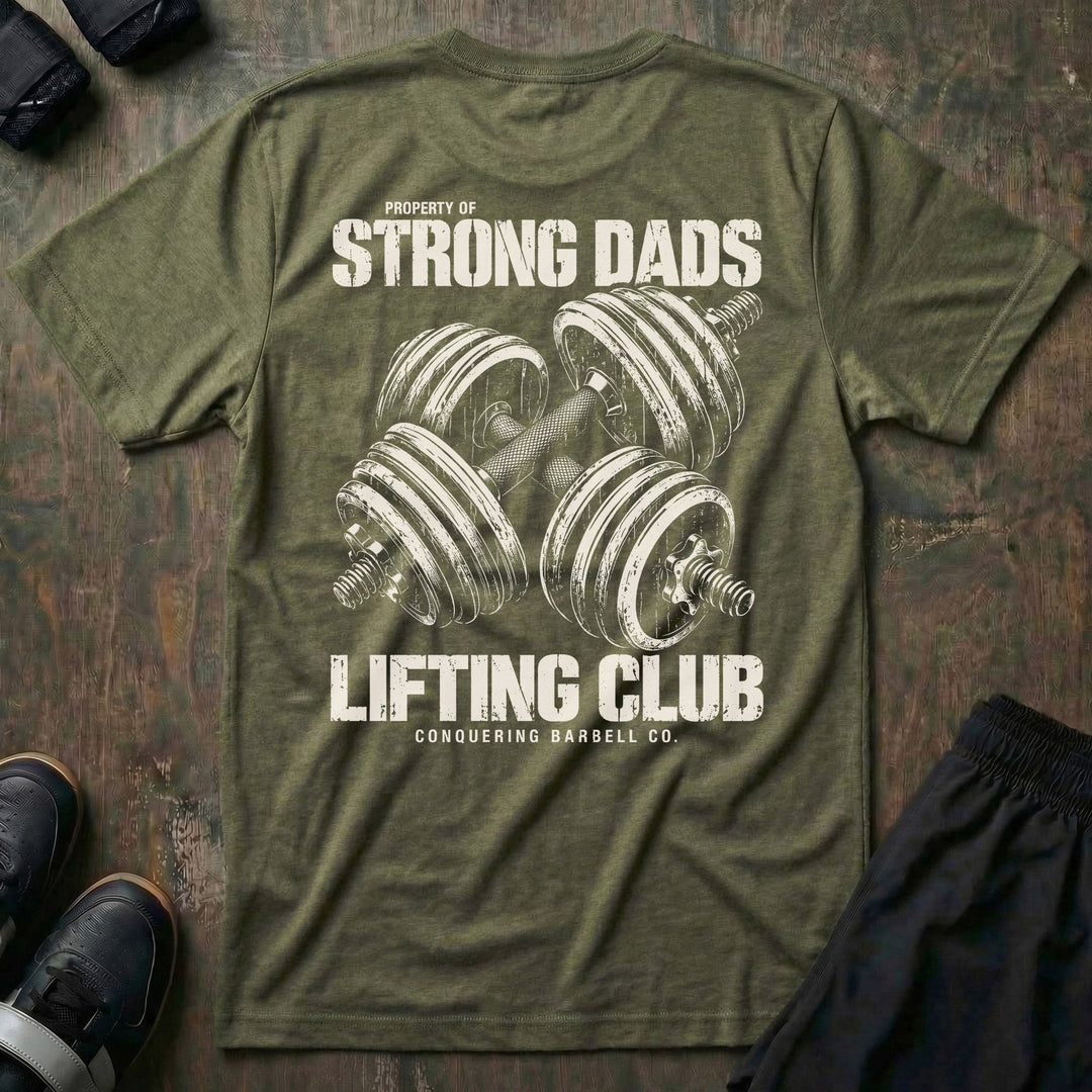 Property of Strong Dads Lifting Club tee in Military: a pair of crossed dumbbells between PROPERTY OF STRONG DADS