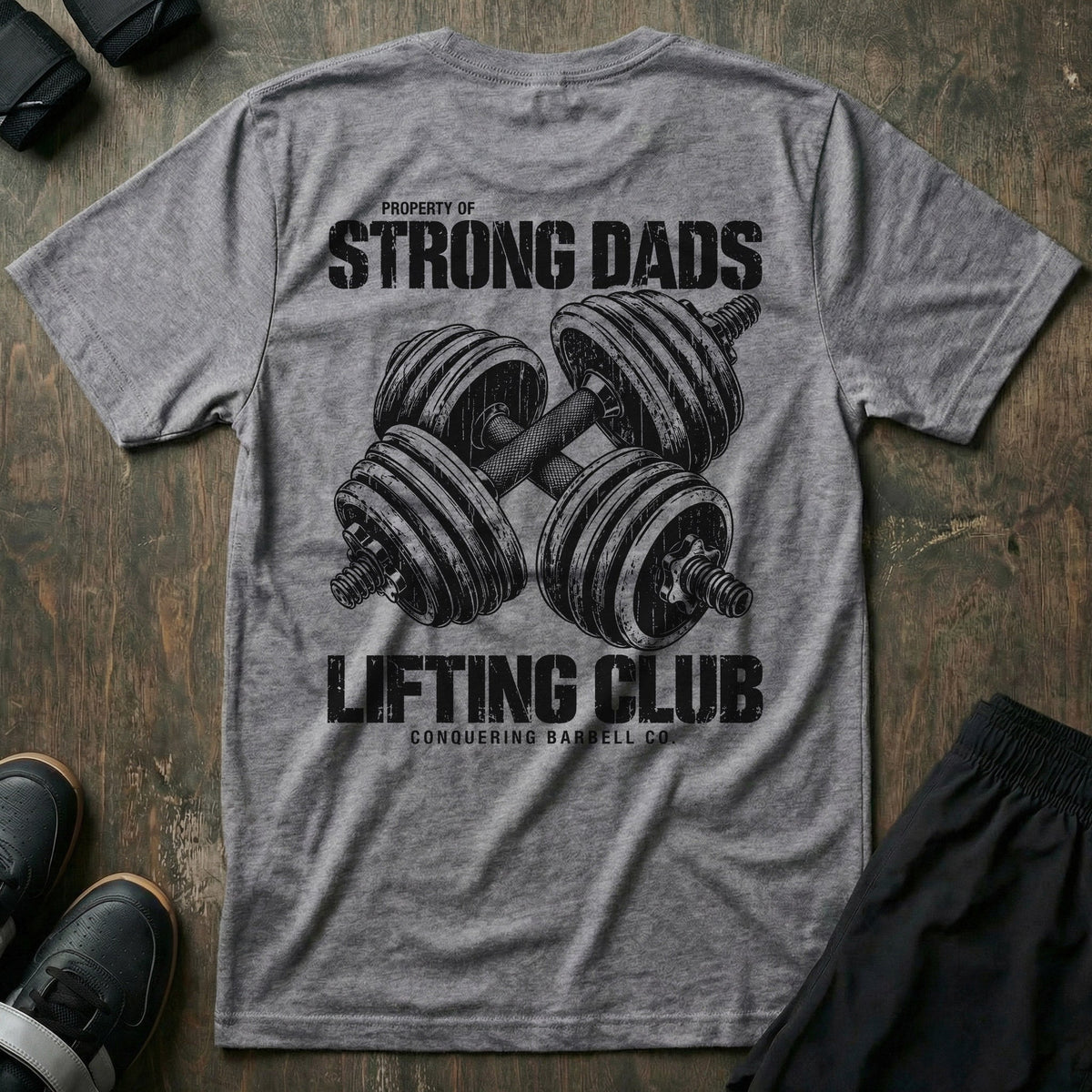 Property of Strong Dads Lifting Club tee in Heather Grey: a pair of crossed dumbbells between PROPERTY OF STRONG DADS