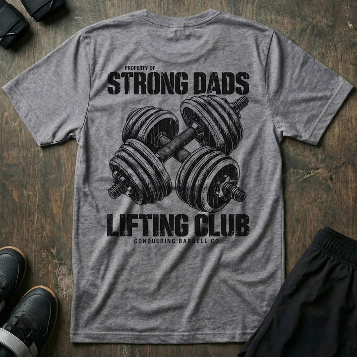 Property of Strong Dads Lifting Club tee in Heather Grey: a pair of crossed dumbbells between PROPERTY OF STRONG DADS
