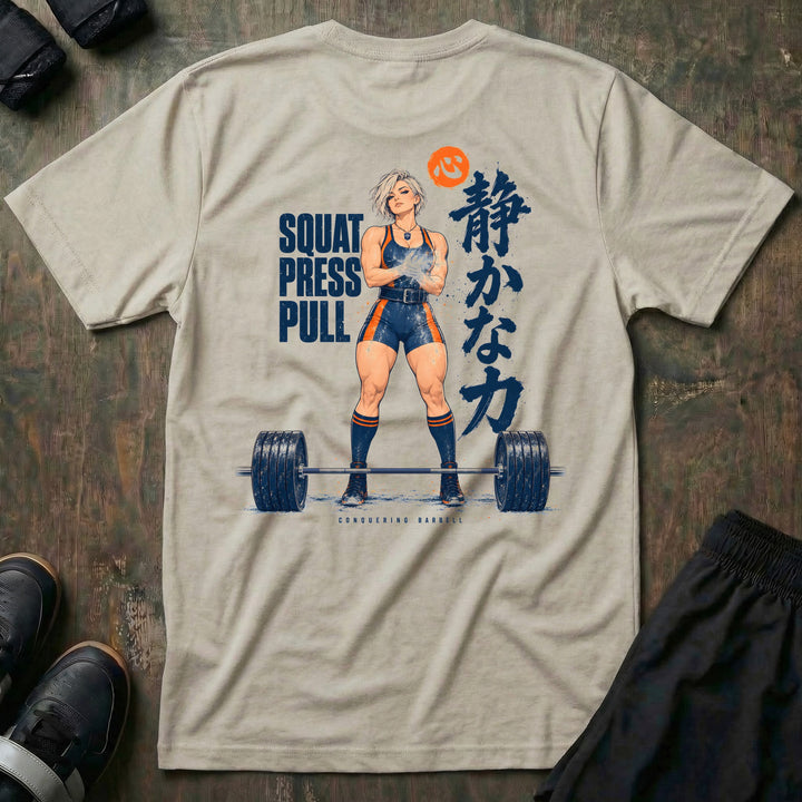 Quiet Power tee in Sand: an anime lifter chalking up behind a loaded deadlift bar with SQUAT PRESS PULL