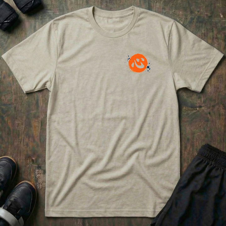 Quiet Power tee in Sand, left chest: orange brush circle with the kanji for heart