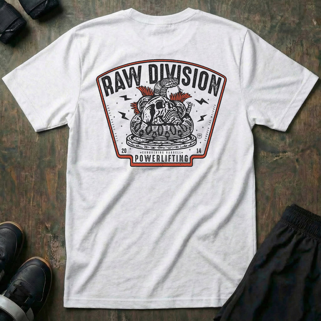 Raw Division tee in White: a coiled rattlesnake wrapped around a skull on a stack of weight plates inside a bold badge