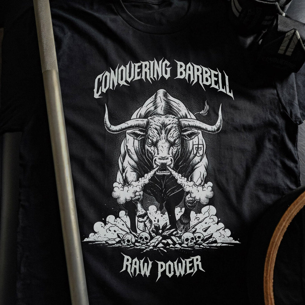 Raw Power Bull tee in Black: a raging bull blasting through a cloud of chalk dust with smoke pouring from its nostrils