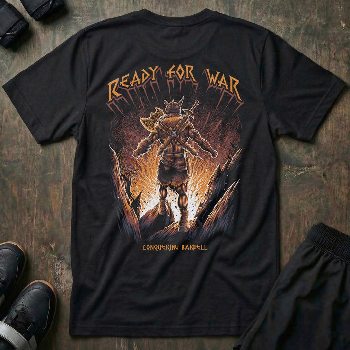 Ready for War tee in Black: an armored Viking warrior in full battle gear striding out of a wall of fire in orange and gold