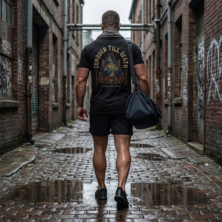 Reaper Rose tee in Black: a hooded reaper clutching a loaded barbell plate against a backdrop of flames