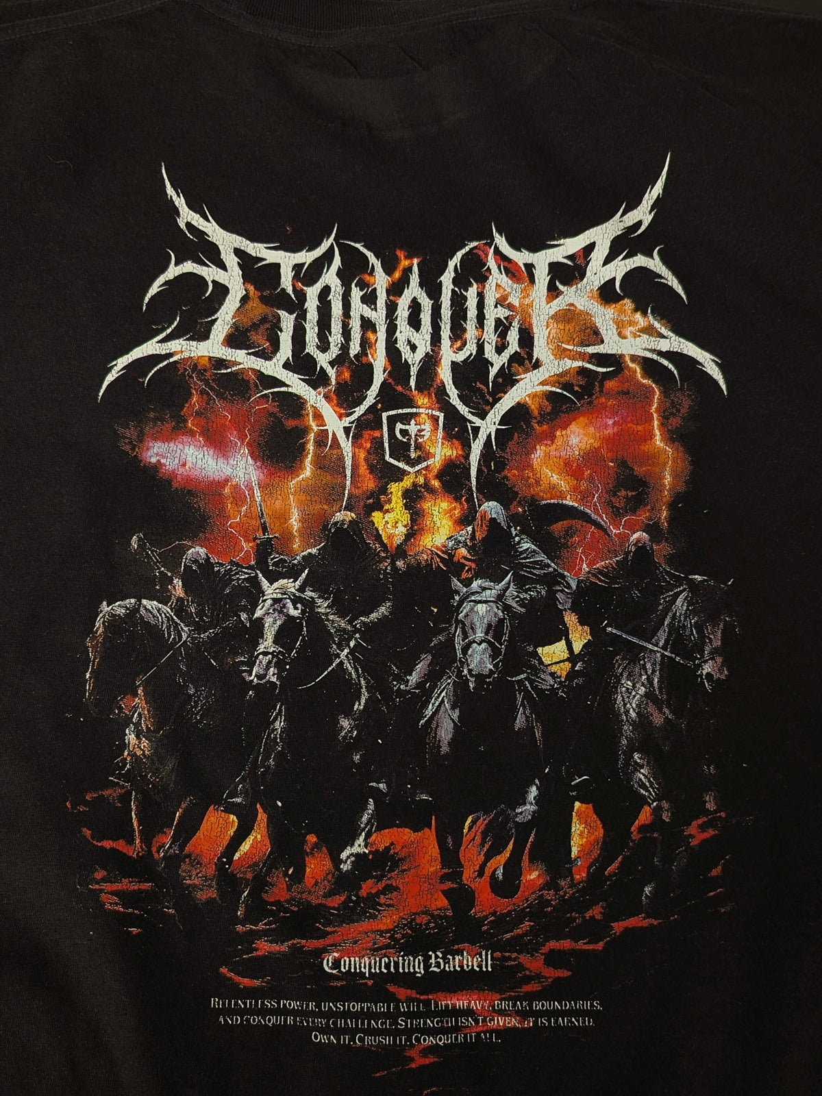 Conquering Barbell relaxed fit tee in black with a full back print, shot in the print shop