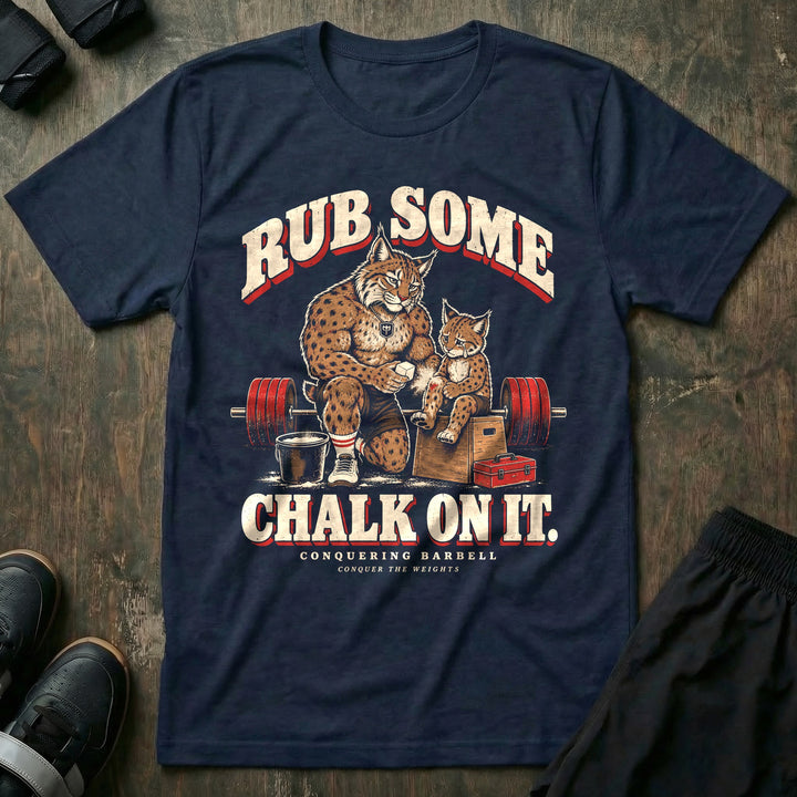 Rub Some Chalk on It - Tee front graphic in Navy with a bobcat dad kneeling and rubbing chalk on the leg of a crying bobcat cub sitting on a wooden box - Conquering Barbell