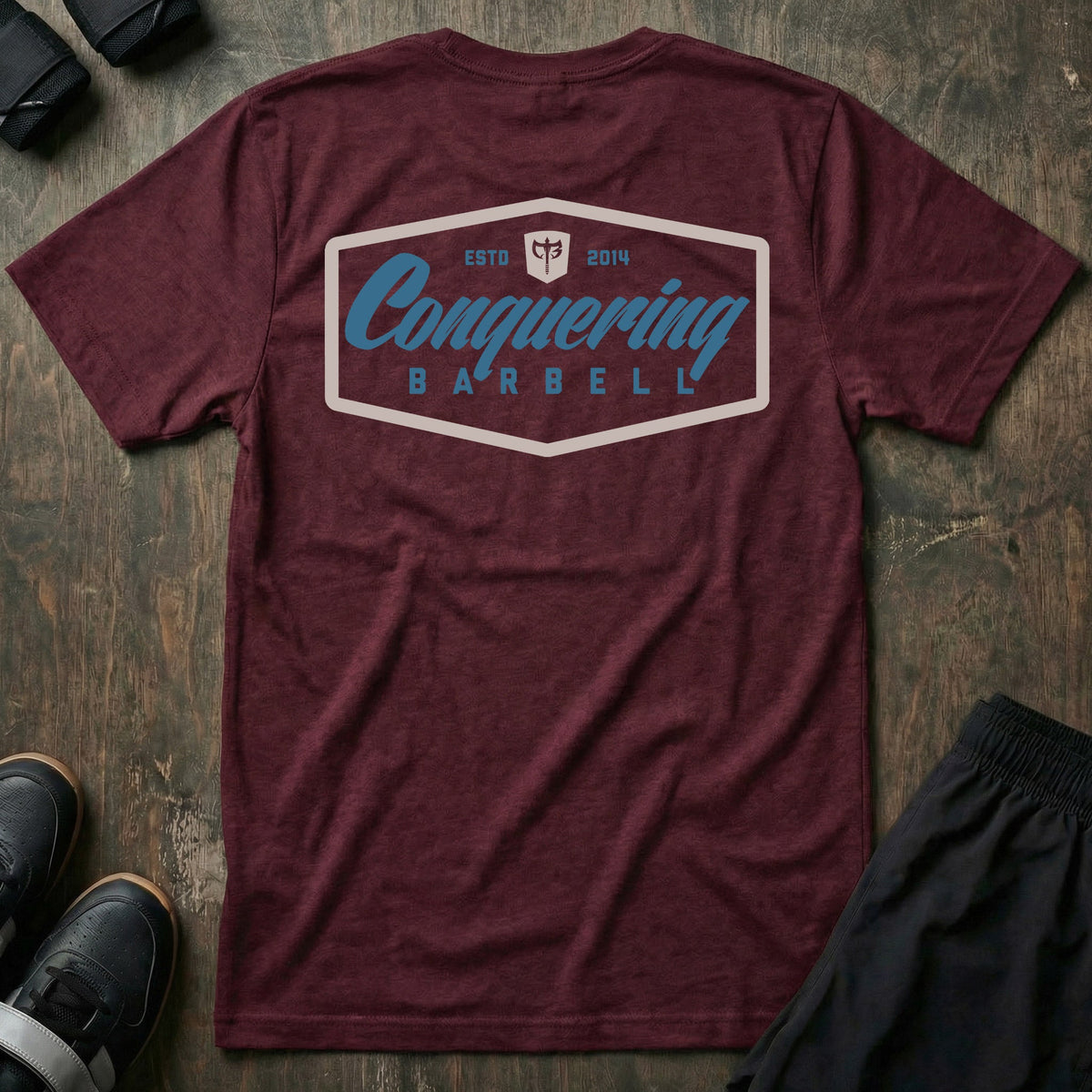 Script Logo Summer Vibes Edition tee in Maroon: the classic Conquering Barbell script logo inside a bold badge frame