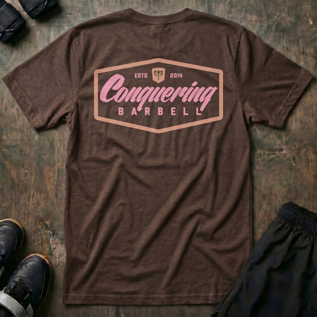 Script Logo Summer Vibes Edition tee in Expresso: the classic Conquering Barbell script logo inside a bold badge frame