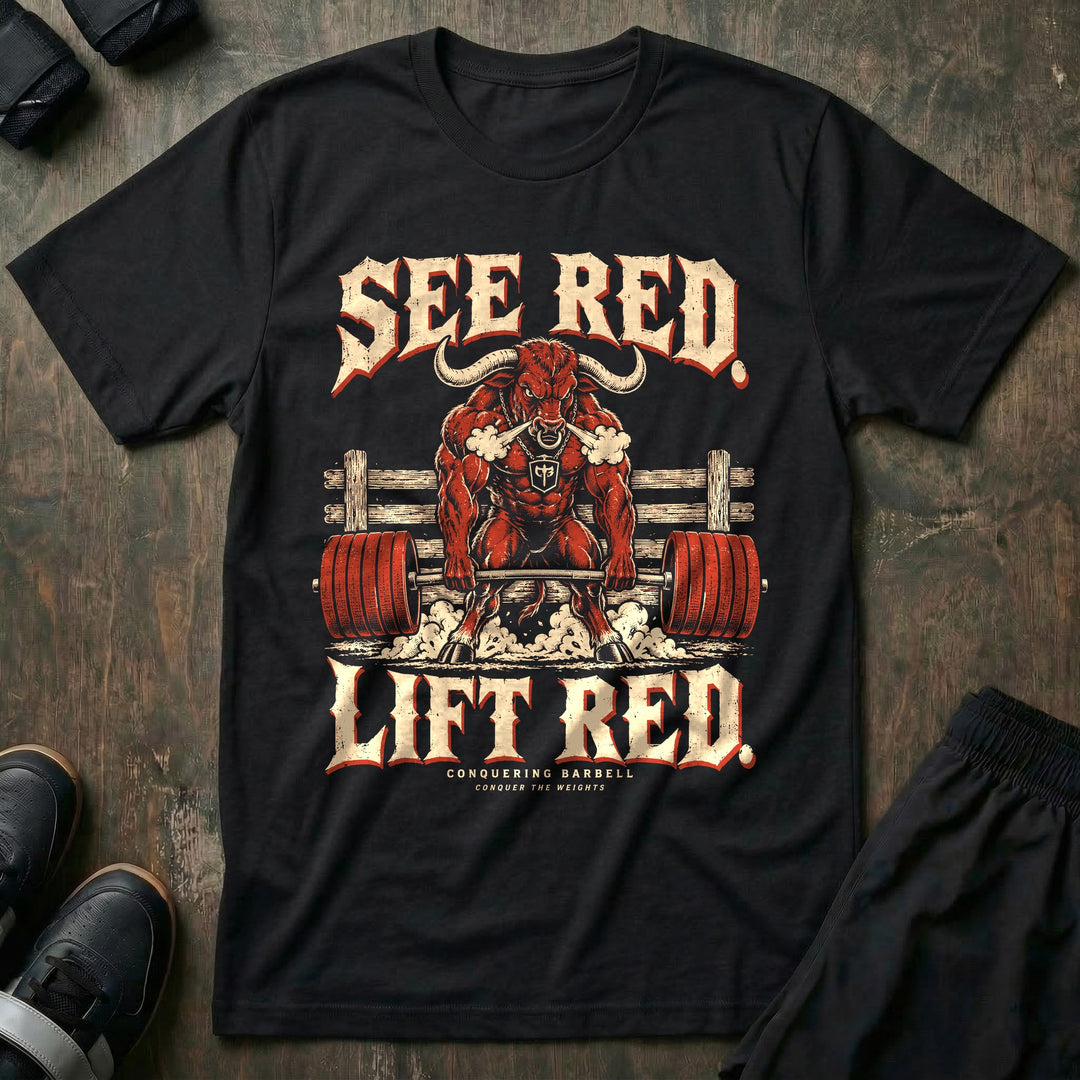 See Red Lift Red - Tee front graphic in Black with a red bull snorting steam and deadlifting a barbell loaded with red plates - Conquering Barbell