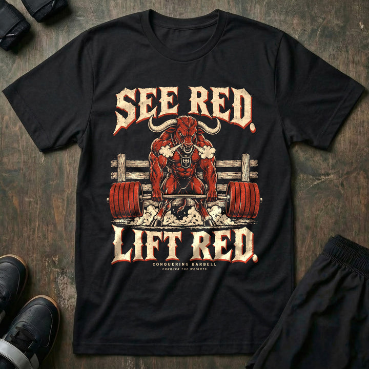 See Red Lift Red - Tee front graphic in Black with a red bull snorting steam and deadlifting a barbell loaded with red plates - Conquering Barbell