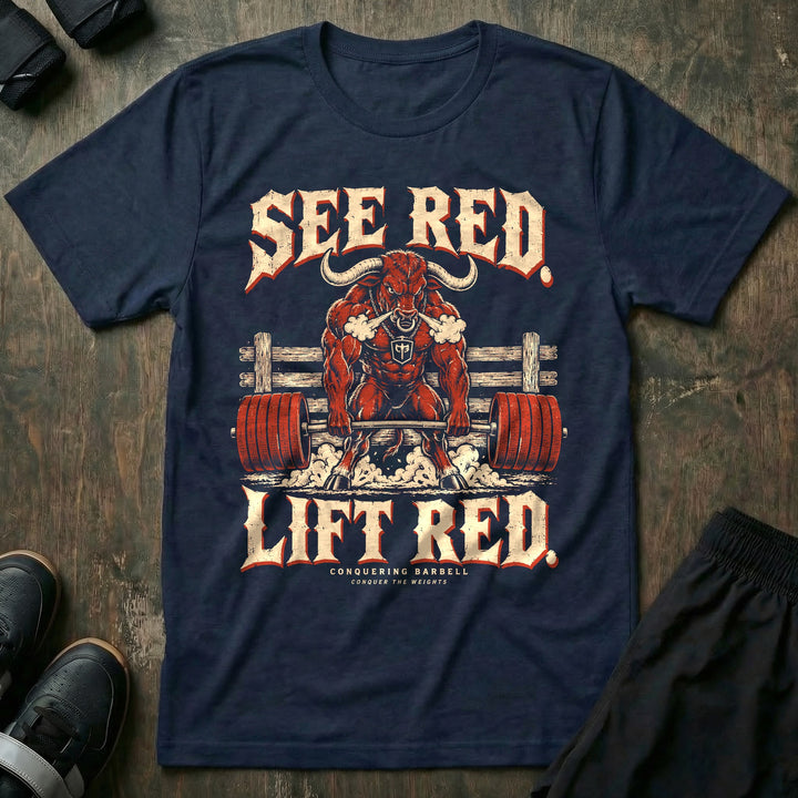 See Red Lift Red - Tee front graphic in Navy with a red bull snorting steam and deadlifting a barbell loaded with red plates - Conquering Barbell