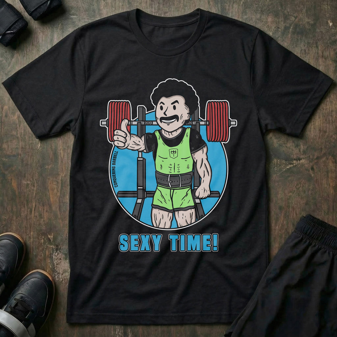 Sexy Time! tee in Black: a moustached cartoon lifter in a lime green one-piece giving a thumbs up
