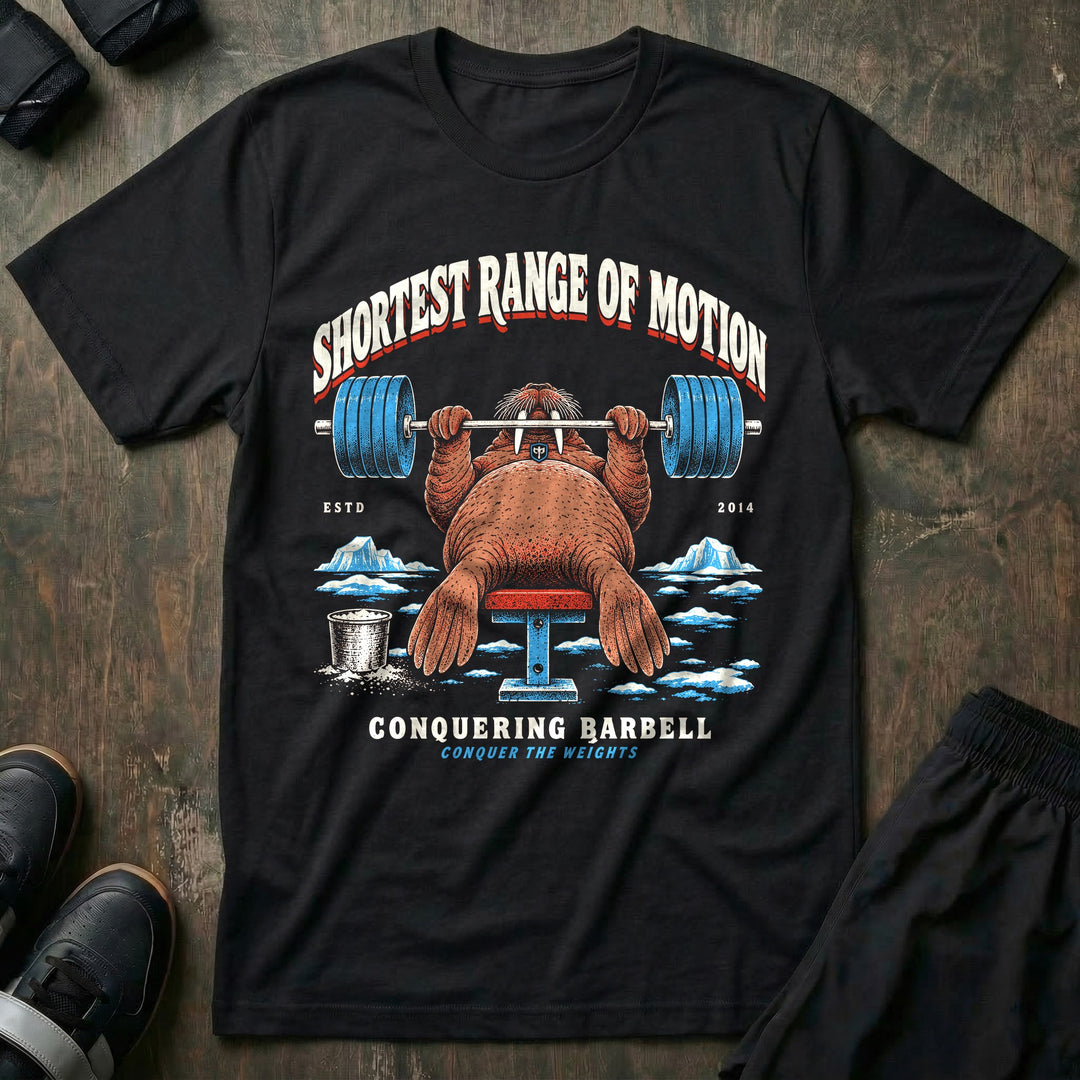 Shortest Range of Motion - Tee front graphic in Black with a walrus bench pressing a loaded barbell with short flippers on the ice - Conquering Barbell