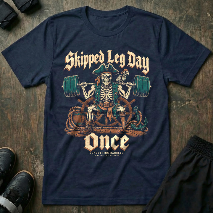 Skipped Leg Day Once - Tee front graphic in Navy with a peg-legged skeleton pirate with a loaded barbell on his back - Conquering Barbell