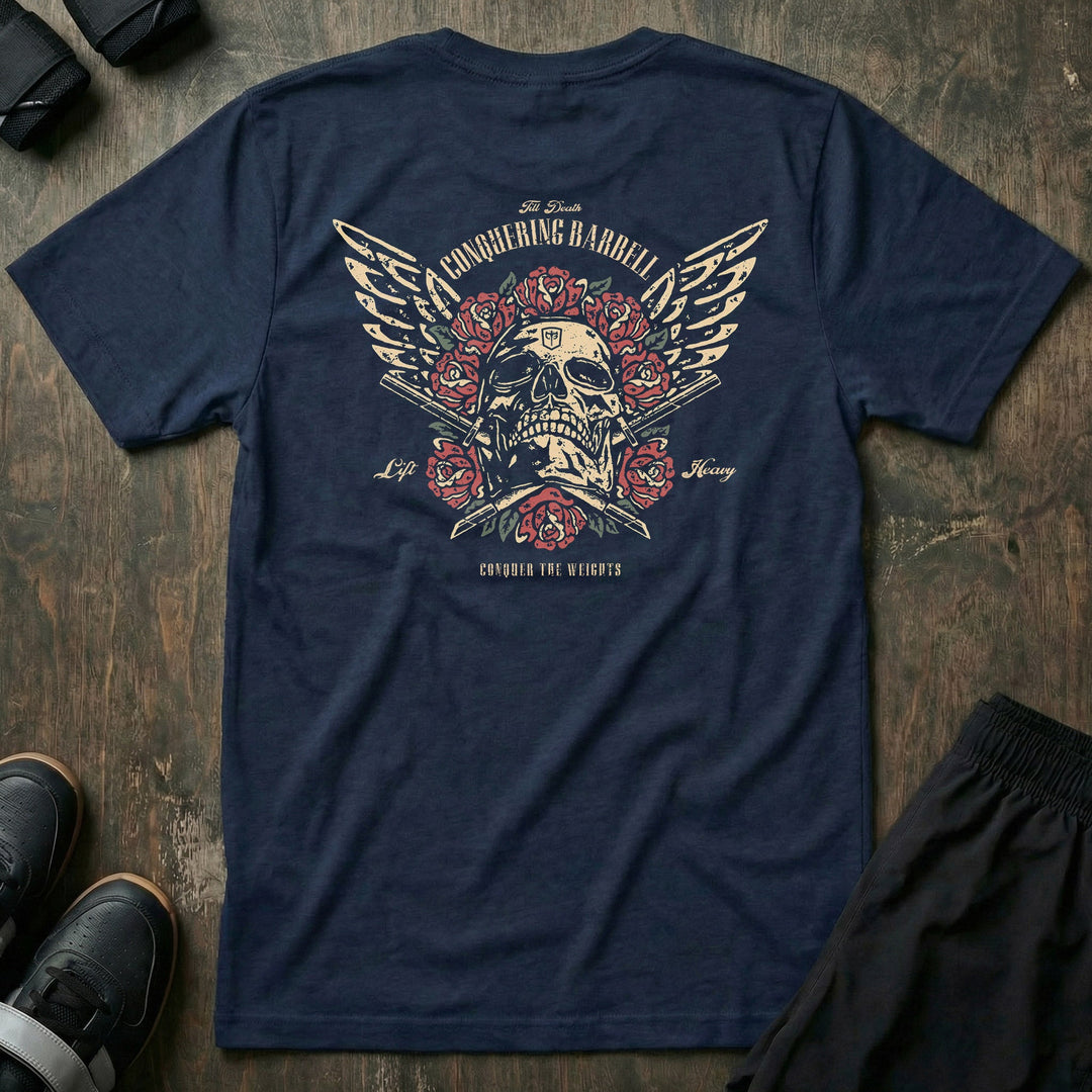Skull &amp; Roses tee in Navy: a winged skull crowned in traditional red roses above crossed barbell sleeves