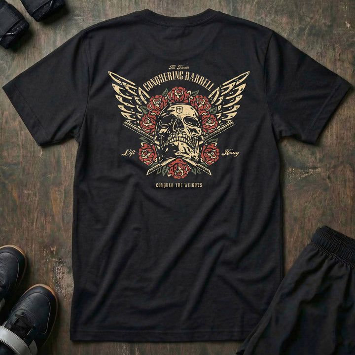 Skull &amp; Roses tee in Black: a winged skull crowned in traditional red roses above crossed barbell sleeves