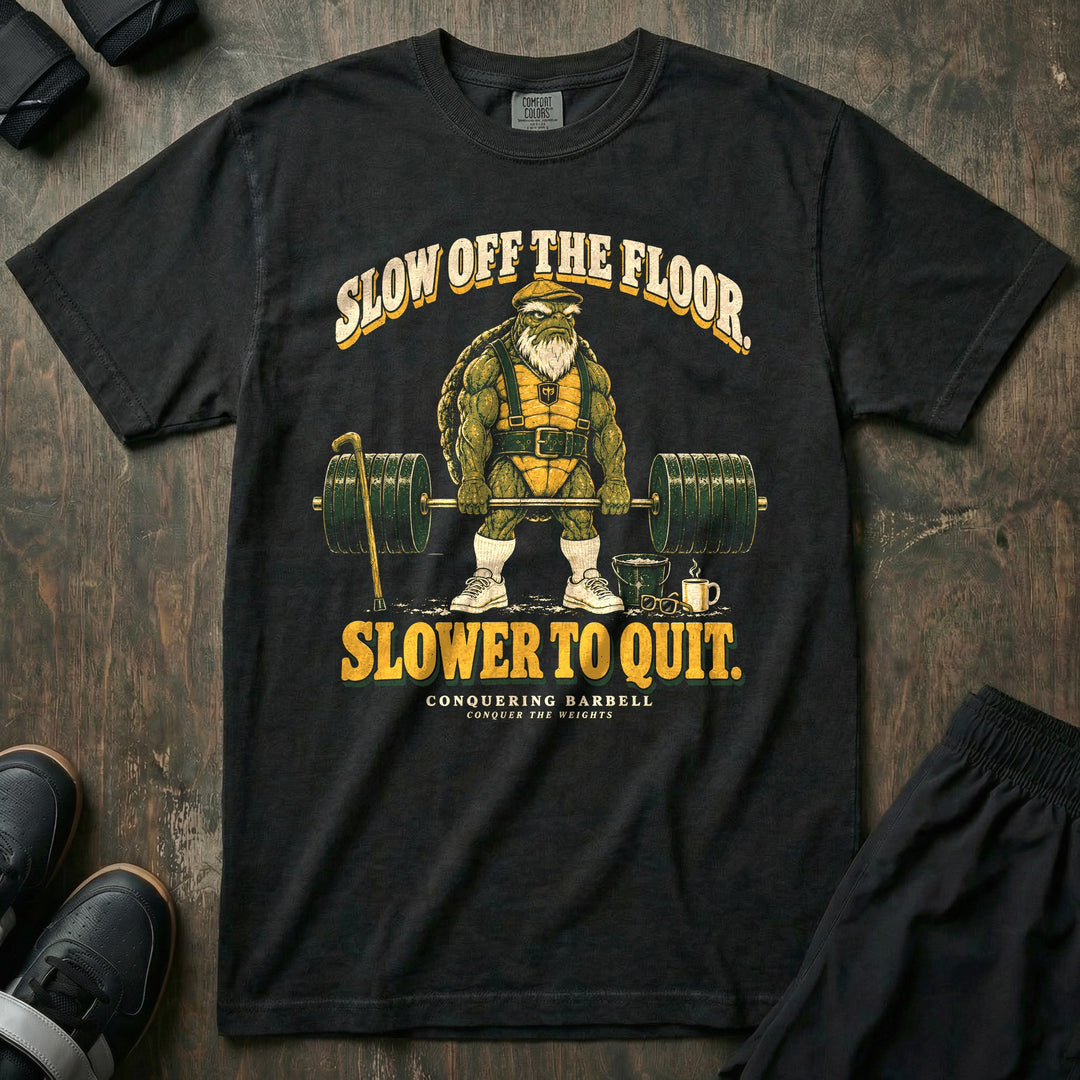 Slow Off the Floor Slower to Quit - Relaxed Fit Tee front graphic in Black with an old bearded tortoise in a flat cap at deadlift lockout - Conquering Barbell
