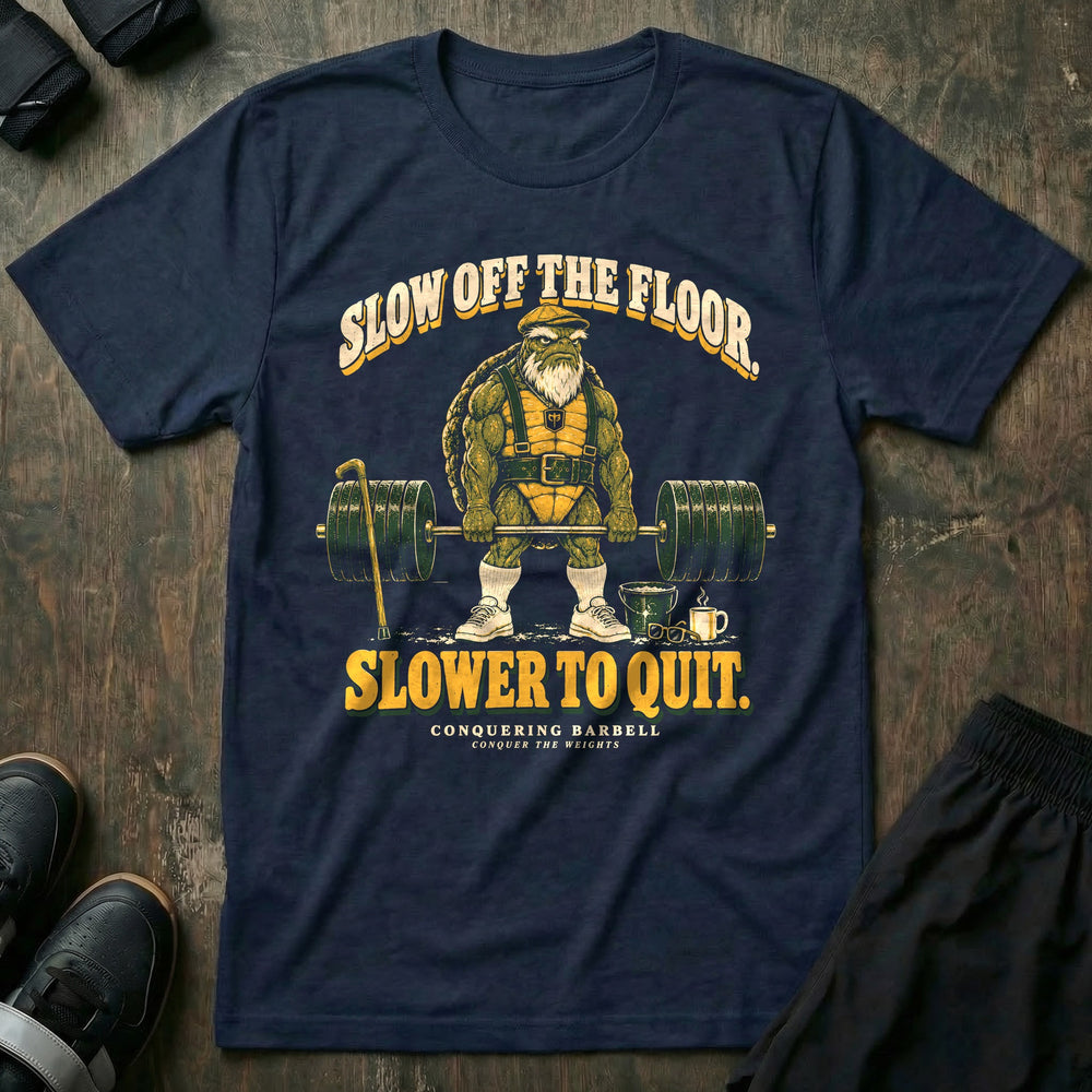 Slow Off the Floor Slower to Quit - Tee front graphic in Navy with an old bearded tortoise in a flat cap at deadlift lockout - Conquering Barbell
