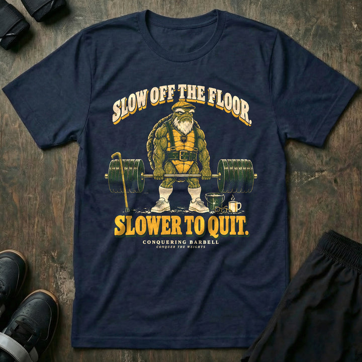 Slow Off the Floor Slower to Quit - Tee front graphic in Navy with an old bearded tortoise in a flat cap at deadlift lockout - Conquering Barbell
