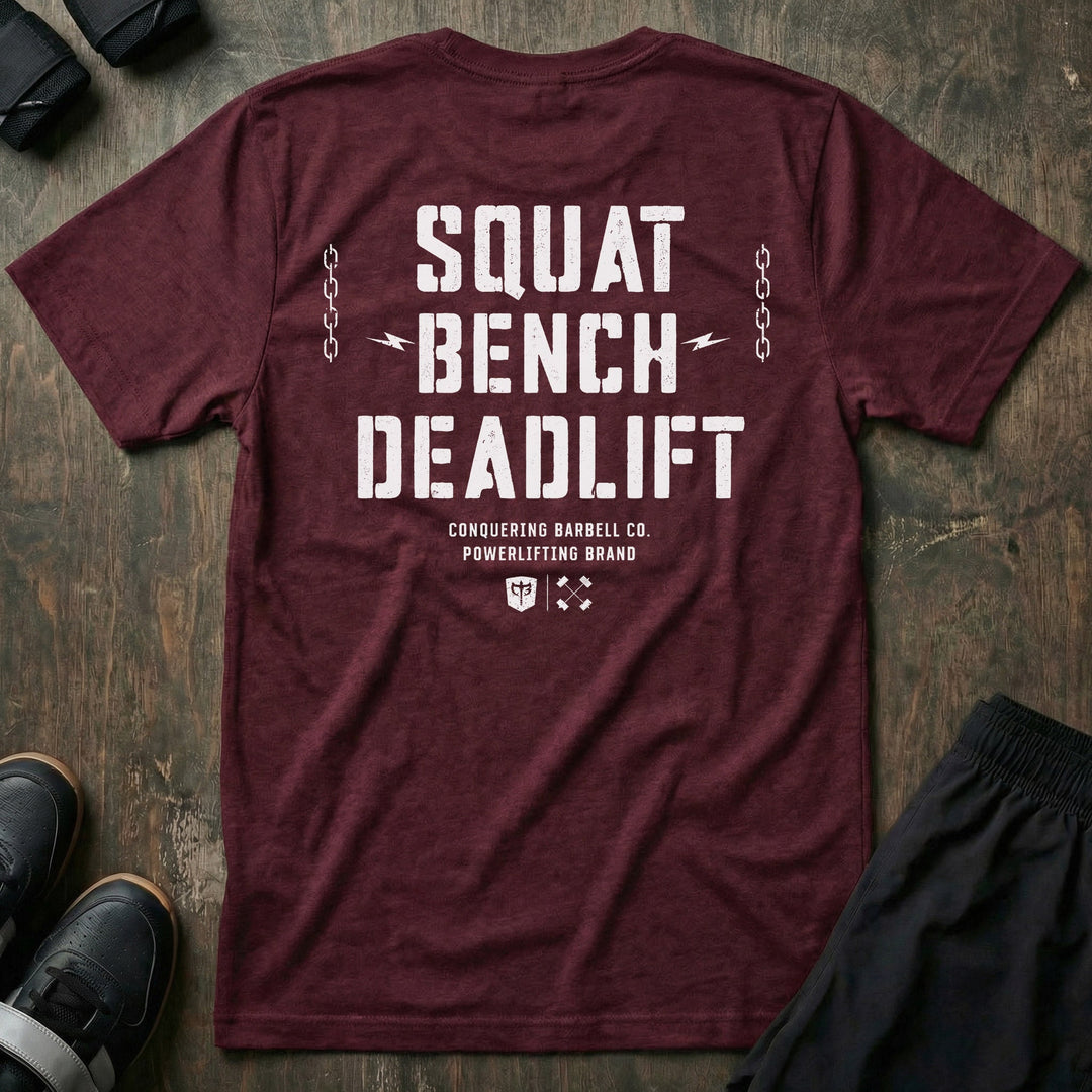 Squat Bench Deadlift Chains tee in Maroon: SQUAT BENCH DEADLIFT in oversized distressed block lettering stacked down the back