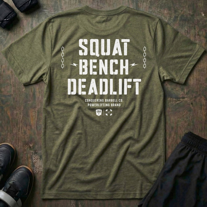 Squat Bench Deadlift Chains tee in Military: SQUAT BENCH DEADLIFT in oversized distressed block lettering stacked down