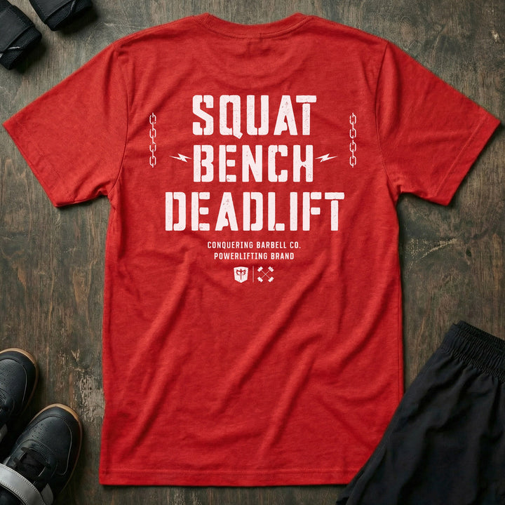 Squat Bench Deadlift Chains tee in Red: SQUAT BENCH DEADLIFT in oversized distressed block lettering stacked down the back