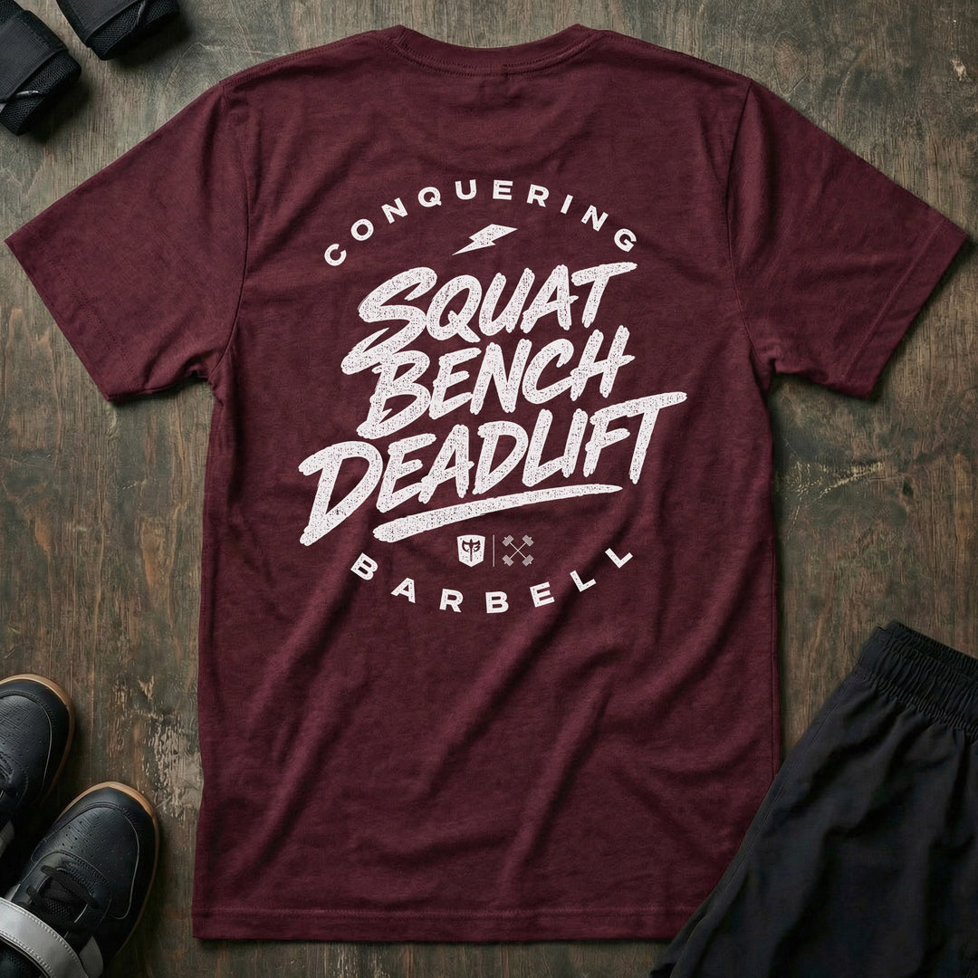 Squat Bench Deadlift Lightning tee in Maroon: SQUAT BENCH DEADLIFT in bold brush-style lettering stacked down the back