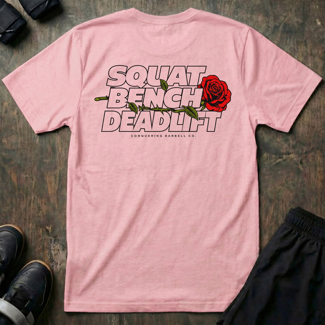 Squat Bench Deadlift Rose tee in Pink: SQUAT BENCH DEADLIFT stacked in bold outlined block lettering across the back
