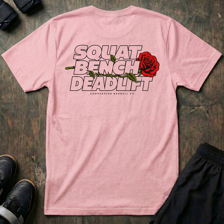 Squat Bench Deadlift Rose tee in Pink: SQUAT BENCH DEADLIFT stacked in bold outlined block lettering across the back