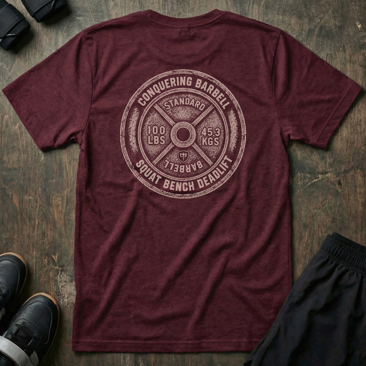 Squat Bench Deadlift Weight Plate tee in Maroon: a massive distressed 100 lb plate with STANDARD stamped at the top
