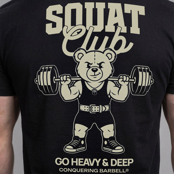 Squat Club tee: a classic teddy bear squatting heavy in a lifting belt with a loaded barbell across his back