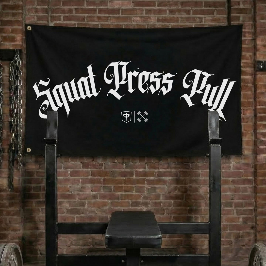 Squat Press Pull® - Arch - Polyester Flag, horizontal black gym flag with Squat Press Pull in a white blackletter arch - Conquering Barbell