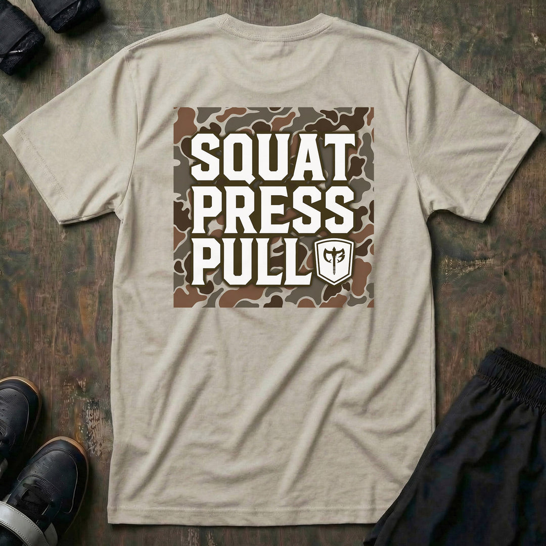Squat Press Pull tee in Sand: SQUAT PRESS PULL stacked in bold white letters with the CB shield