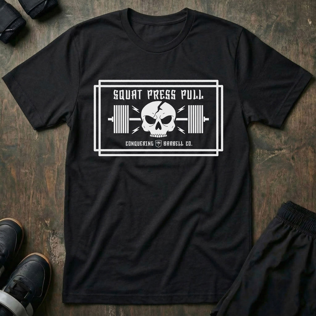 Squat Press Pull (Skull) tee in Black: a skull over a loaded barbell inside a double-line frame