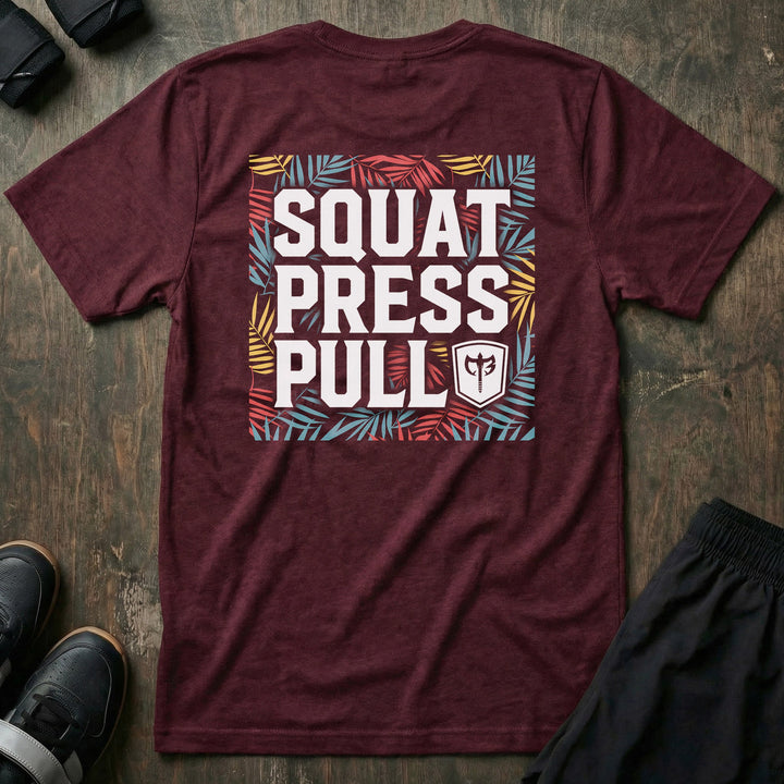 Squat Press Pull Tropical tee in Maroon: SQUAT PRESS PULL stacked in bold white block letters with the CB shield